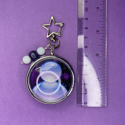 Purple Frutiger aero icon keychain pill case