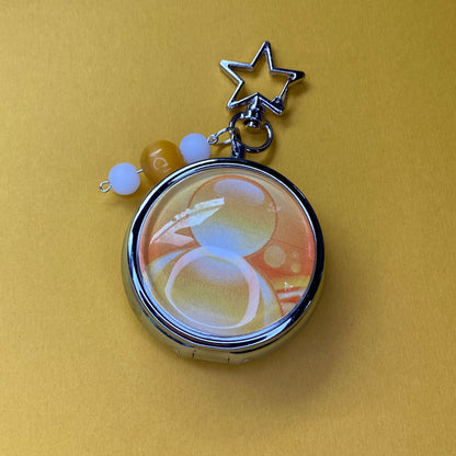 Yellow Frutiger aero icon keychain pill case