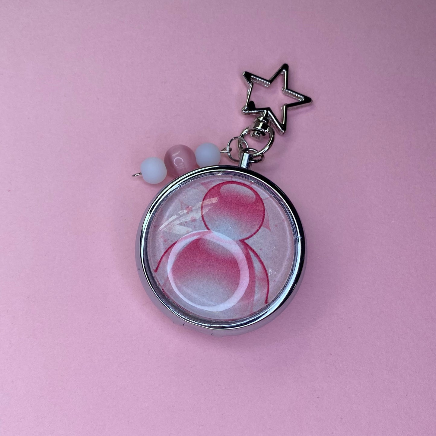 Pink Frutiger aero icon keychain pill case