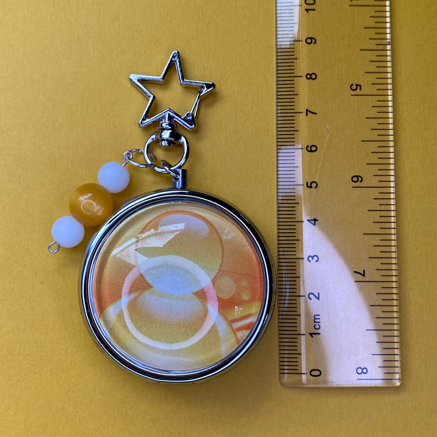 Yellow Frutiger aero icon keychain pill case