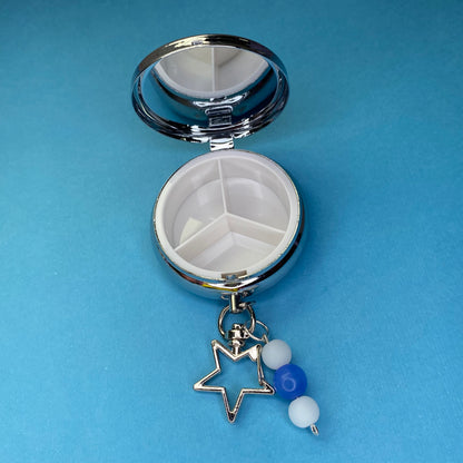 Blue Frutiger aero icon keychain pill case