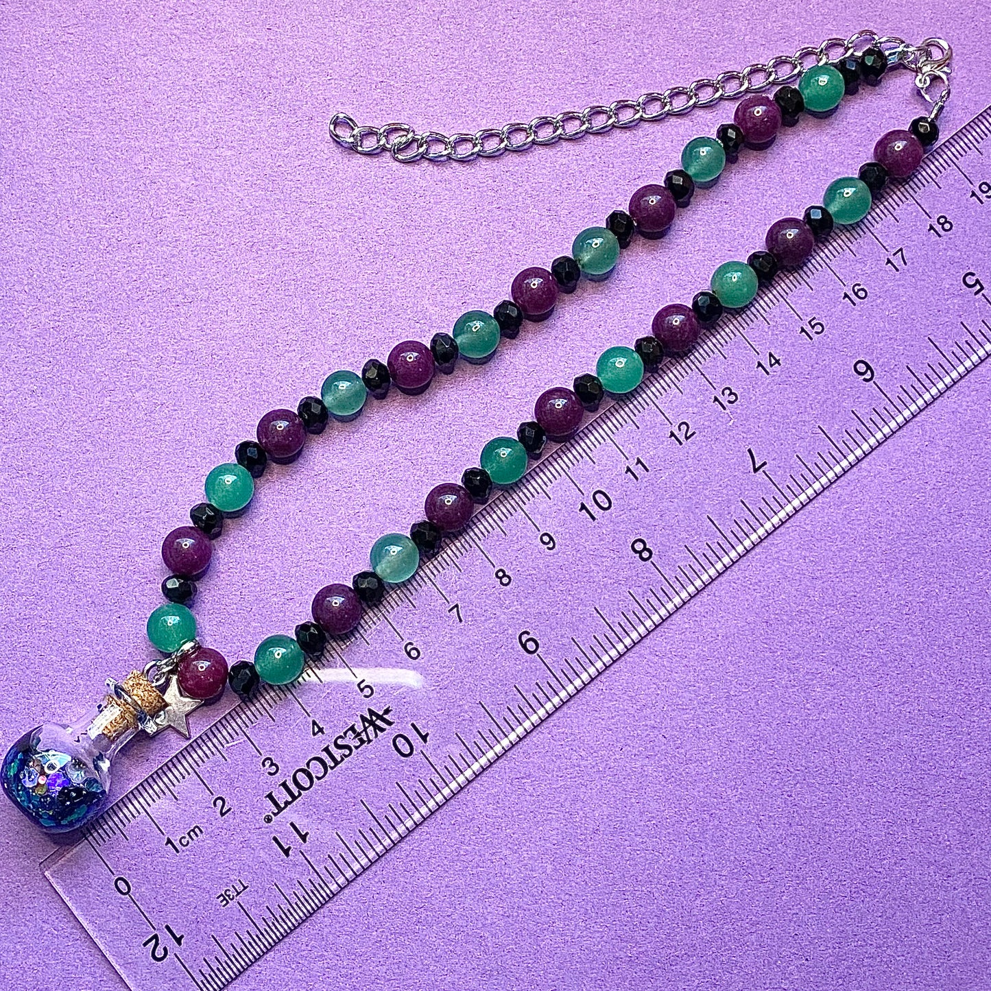 Silver star potion beaded charm necklace