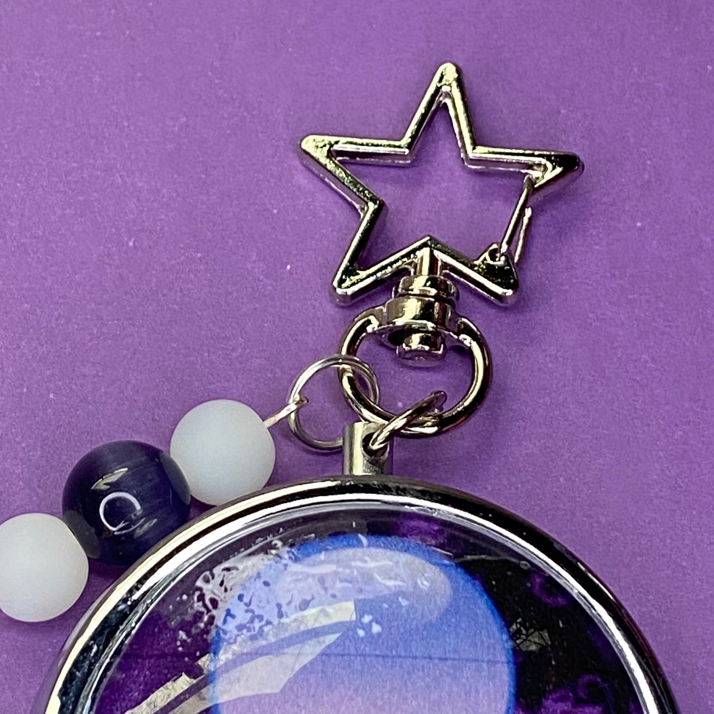 Purple Frutiger aero icon keychain pill case