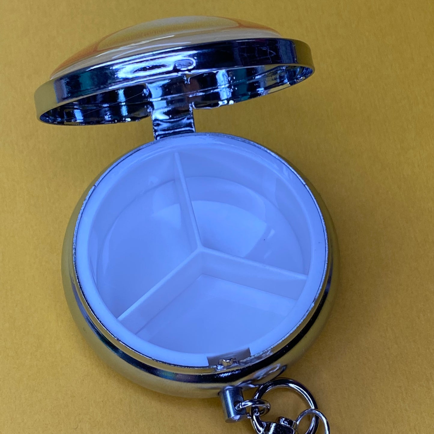 Yellow Frutiger aero icon keychain pill case