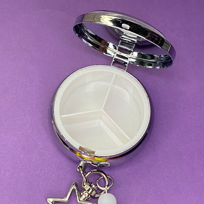 Purple Frutiger aero icon keychain pill case