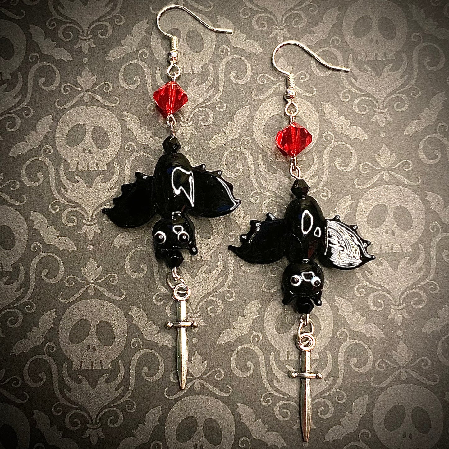 Upside down vampire bat earrings, silver