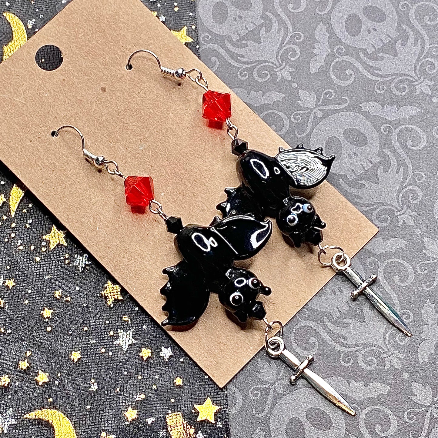 Upside down vampire bat earrings, silver