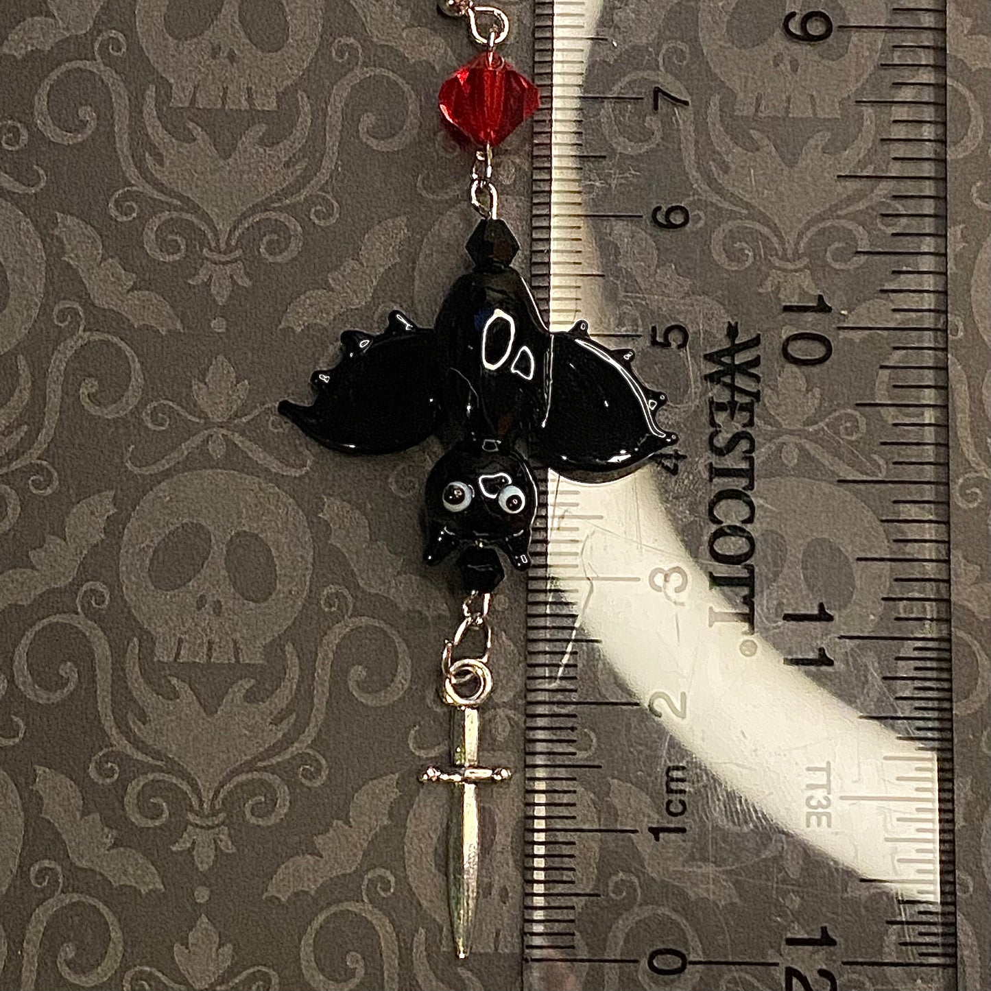 Upside down vampire bat earrings, silver